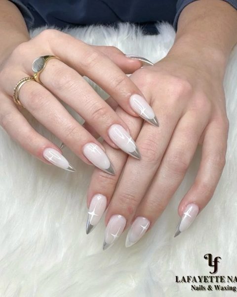 Milky stiletto nails fading to silver-grey tips
