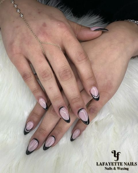 Sheer nude almond nails with black double-line French tips