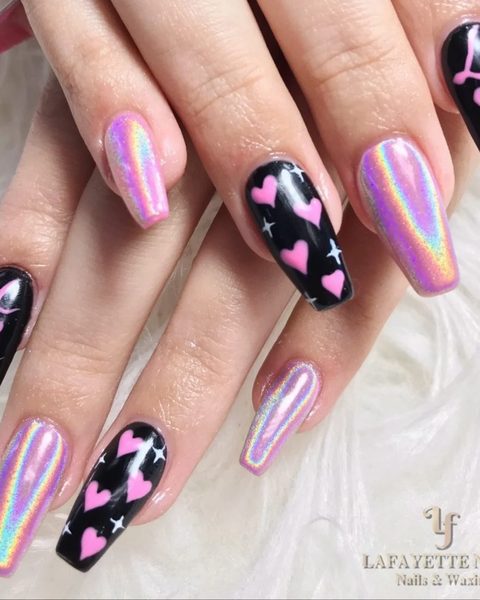 Long coffin nails alternating holographic chrome and black with pink hearts and the word Love