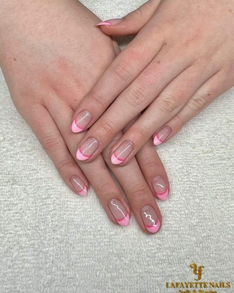 Short natural nails with bright pink French tips